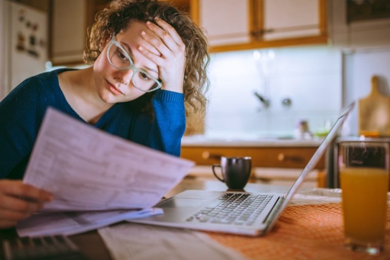 Woman Looking At Bills