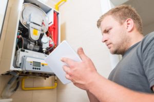 Technician Checking Furnace Efficiency