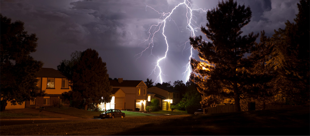 One Home With Lights On During Storm