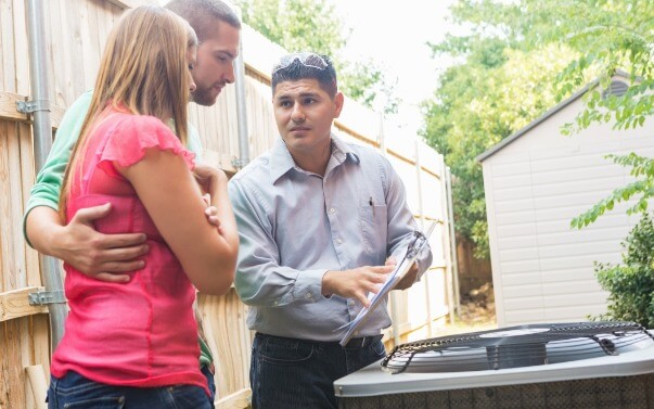 Home Owners Talking To An Hvac Dealer (1)